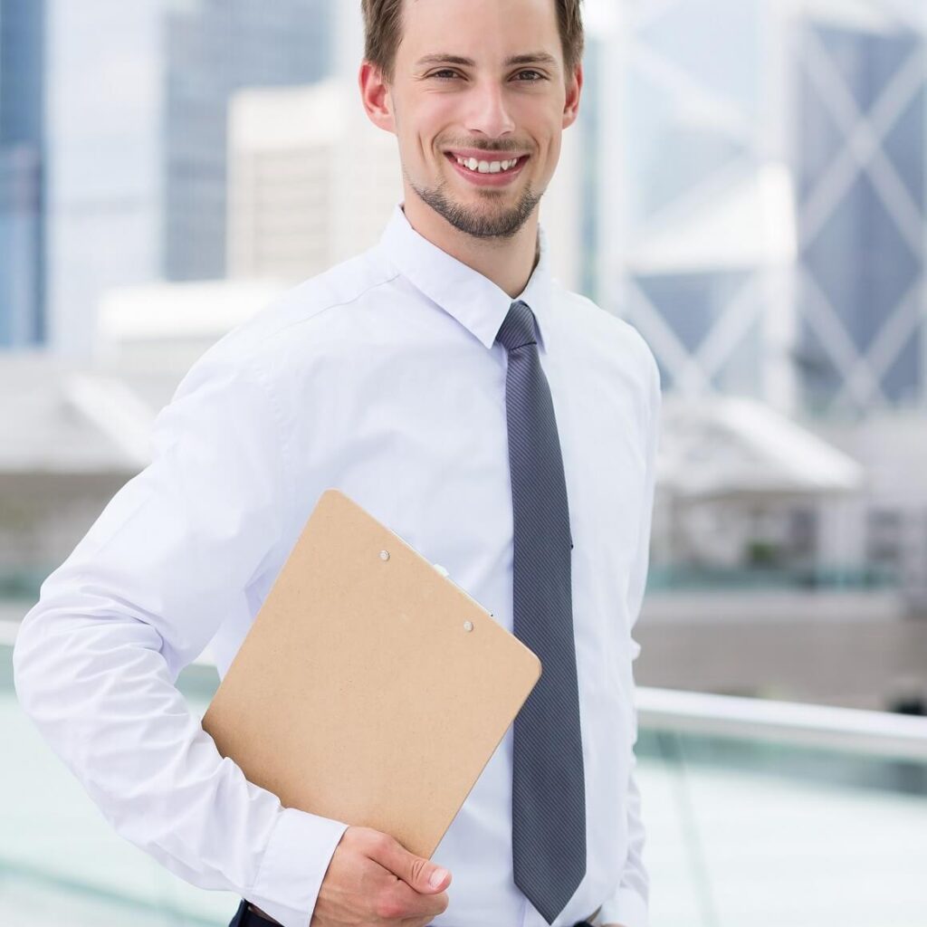 businessman holding with clipboard at outdoor xb3z3rp.jpg