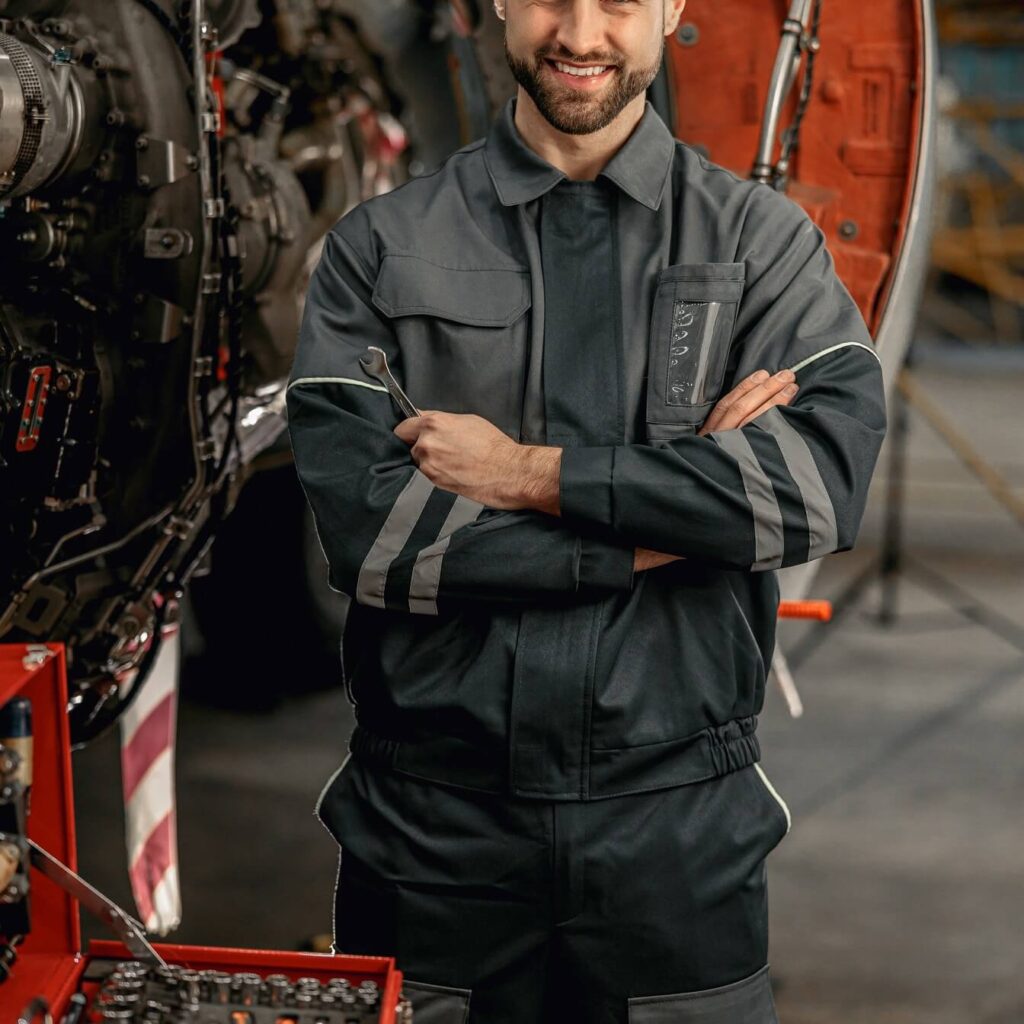 cheerful aircraft mechanic standing near tool box znfx6v3.jpg