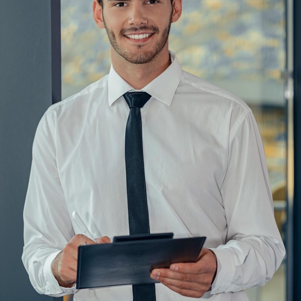handsome young businessman in white shirt holding 4lhmzcs.jpg