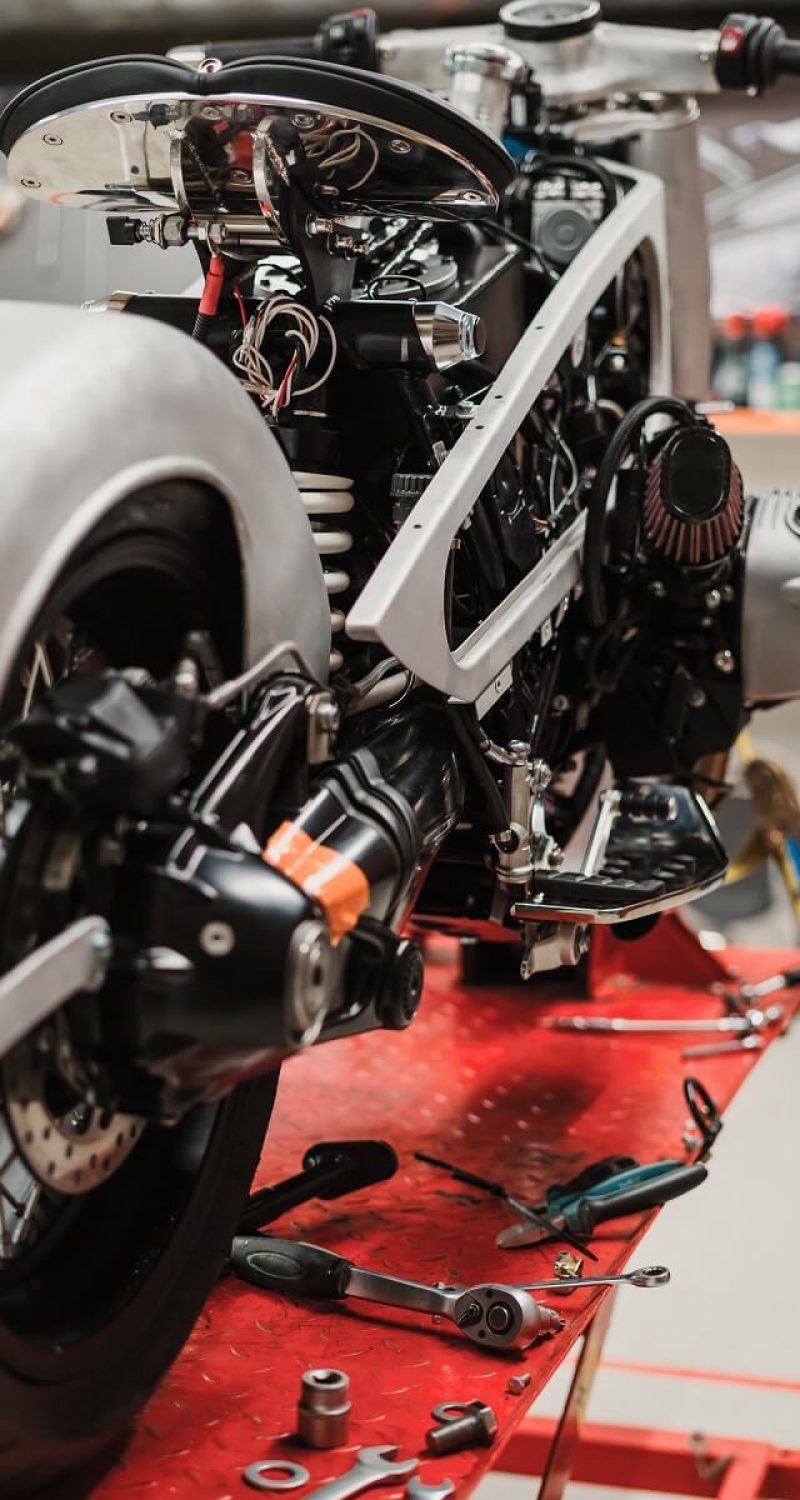 custom motorcycle standing in repair shop pc7hjh6.jpg